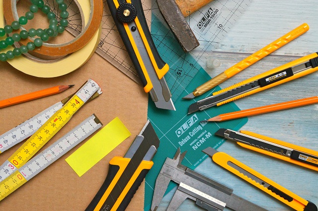 Pile of sewing tools on a desktop