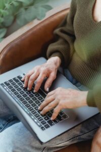 Person using a laptop in their lap