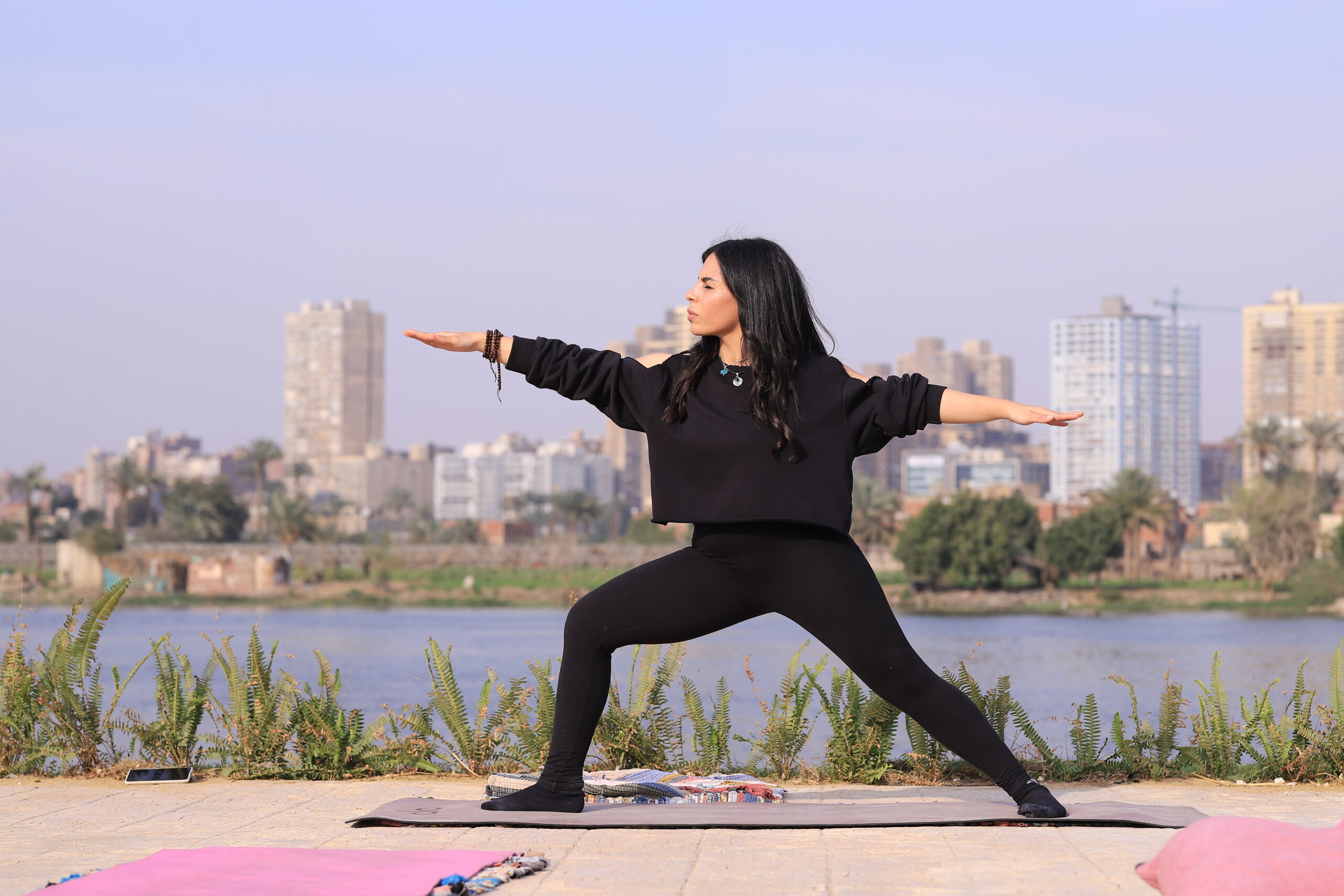 Yoga Instructor Aya from Ahimsa in warrior pose