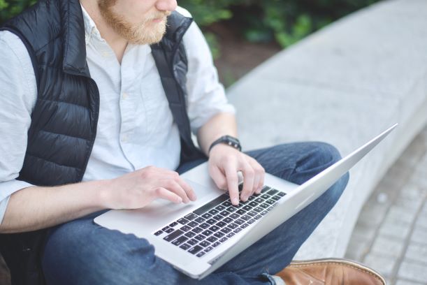 freelance person sitting laptop