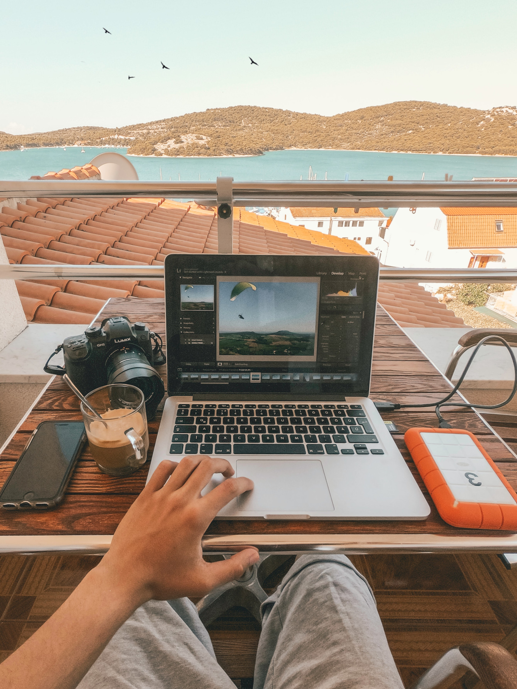 a man working online with a nice view