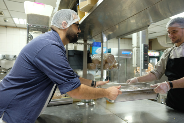 Maen &amp; Tarek at the kitchen of their restaurant.