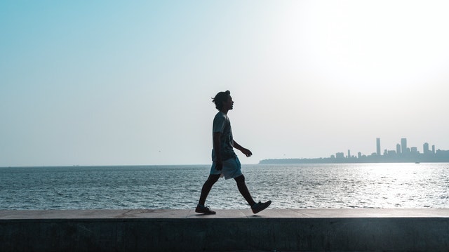 Man walking along the waterfront