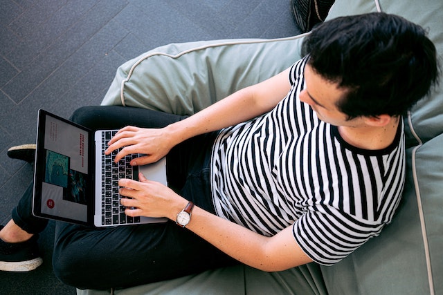 Man Typing On Laptop