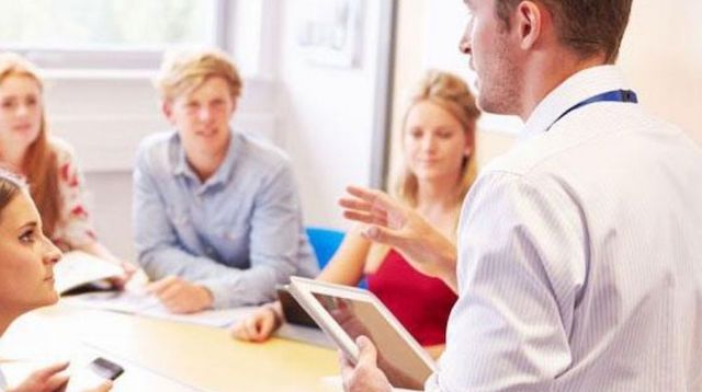 Man Speaking to Room of People