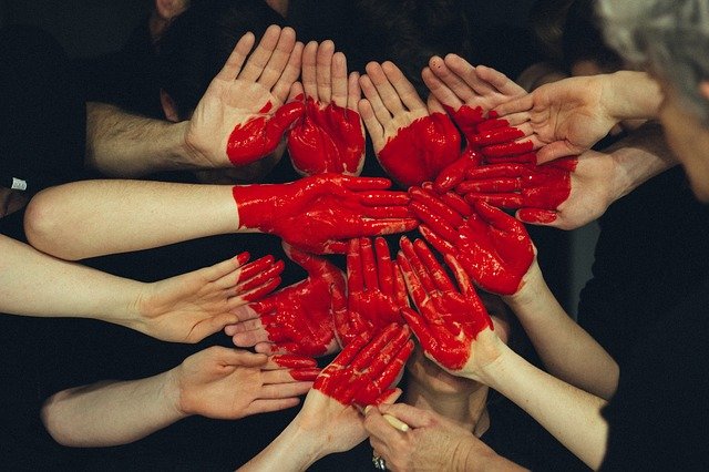 A group of people with their hands together