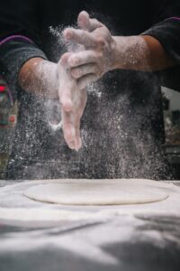 Baker Dusting Flour Off His Hands