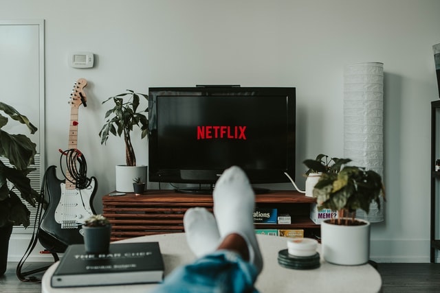 Black flat screen TV displaying Netflix