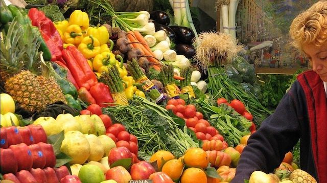 Employee Engagement Woman Restocking Fresh Vegetables