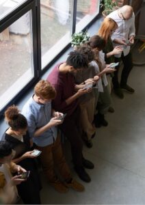 Facebook Advertising Row of People Looking at Phones