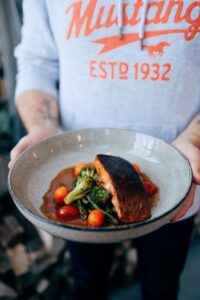 Guy with Plate of Fish and Vegetables