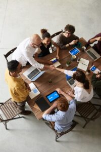 Operations Management Team Working at Table