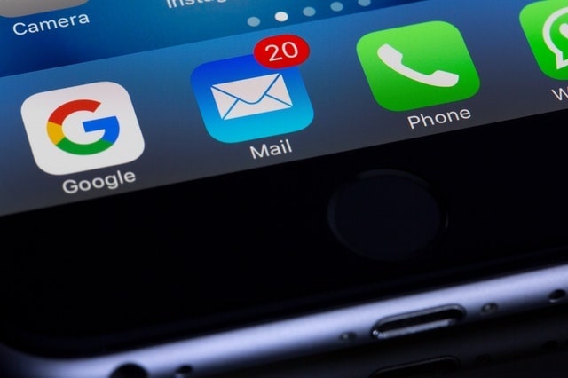 Mail app on smartphone with notification for 20 unread emails.]