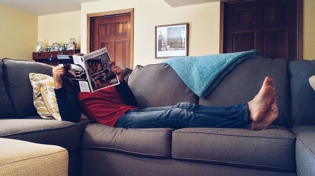 Stress Management Man Reading on Couch