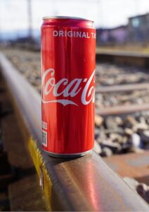 Trade Secrets Coca Cola Can on Rail Tracks