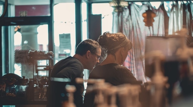 Transition to Retirement Man Looking Over Woman’s Shoulder