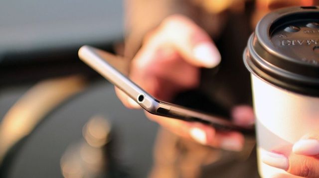 Web Design Woman Holding Cellphone