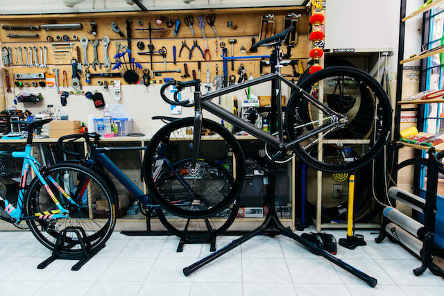 Bike repair workshop filled with equipment and tools