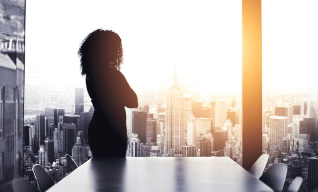 Young businesswoman looking at a cityscape