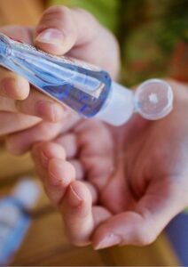 Communication Strategy Person Using Hand Sanitiser