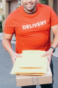 Delivery person in an orange shirt