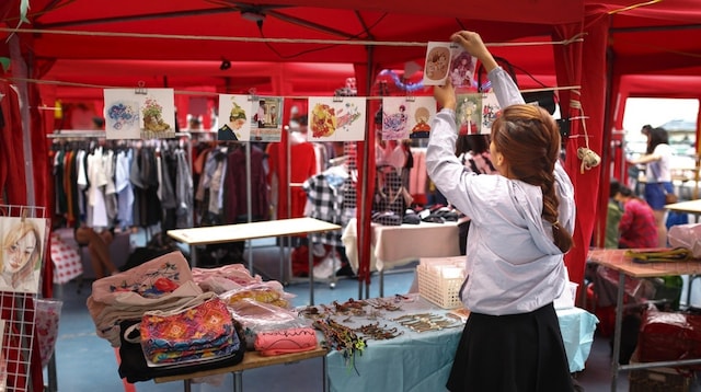 Employee Rights Woman Setting Up Sales Booth