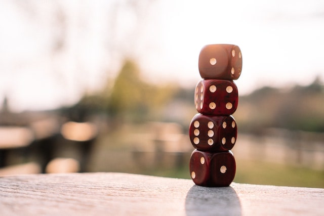 Four red die stacked atop each other