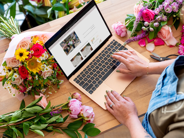 Hannah Manewell working on the Blooms by the Bay website