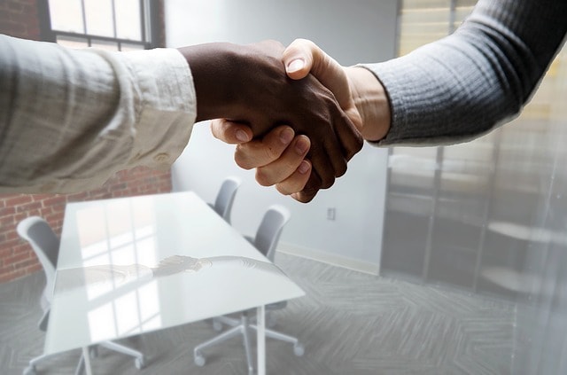 How to Write a Job Description Women Shaking Hands