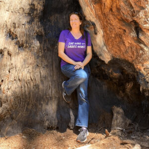 Laura Messerschmitt posing near a sequoia tree