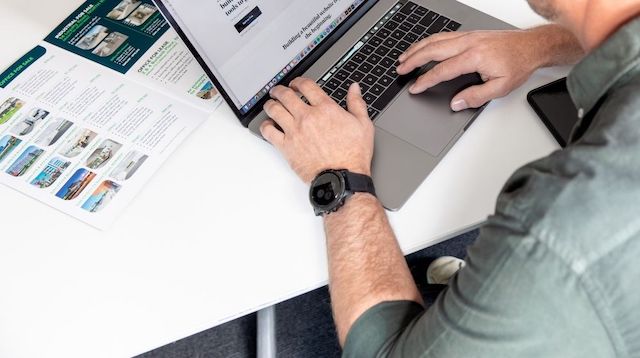 Man at desk working on laptop