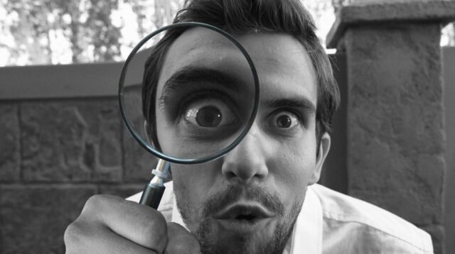 Man with Magnifying Glass