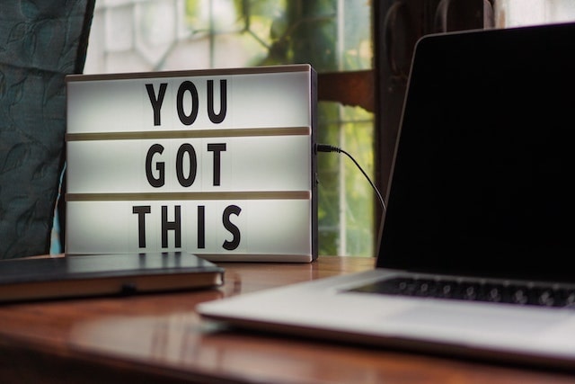 Marquee sign reading “you got this” on desk