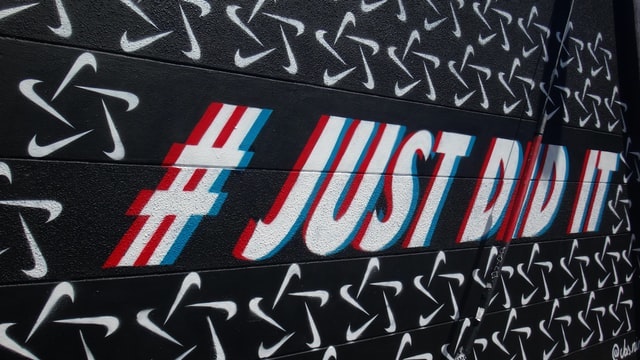 Nike just did it hashtag painted on a gym wall