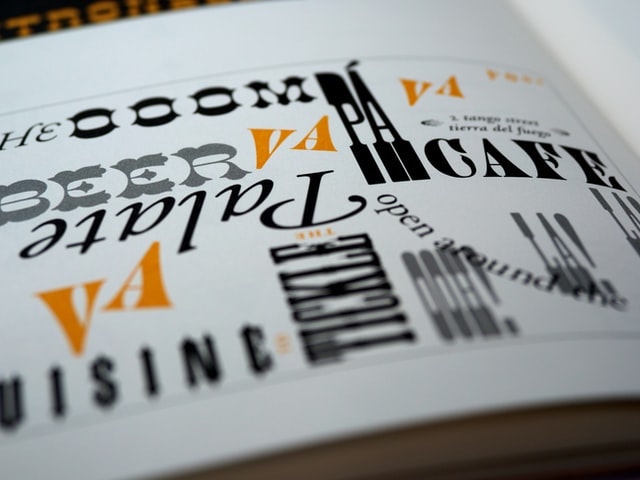 An open book showing various typefaces