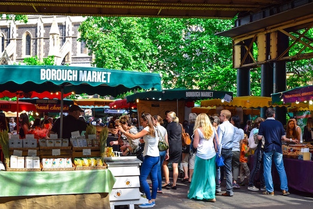 People shopping in outdoor marketplace