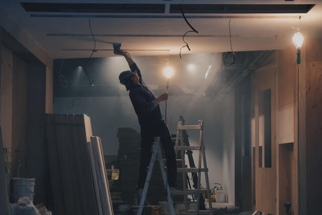 Person working inside a home under construction