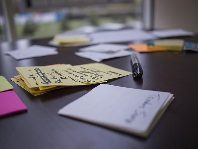 Notes and pen on a desk