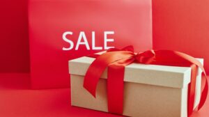 Red sale sign with wrapped box