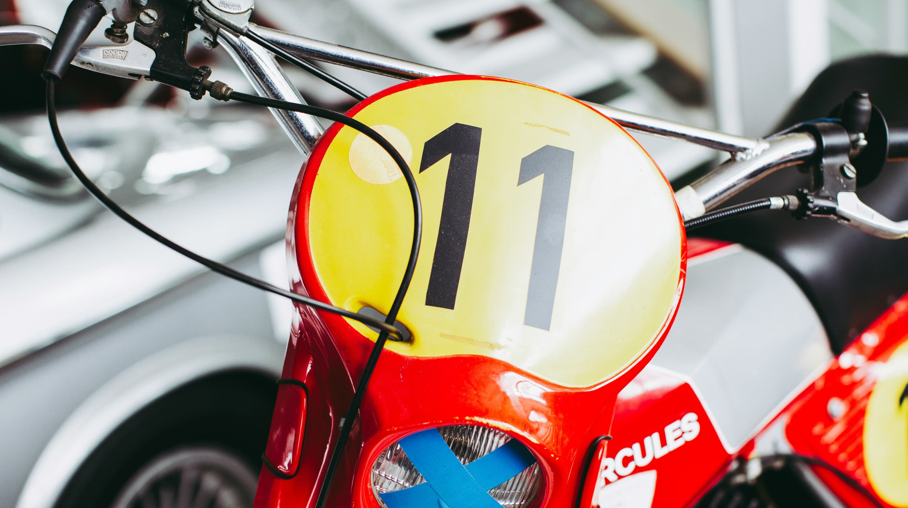 Red motor bike with the number 11 on front