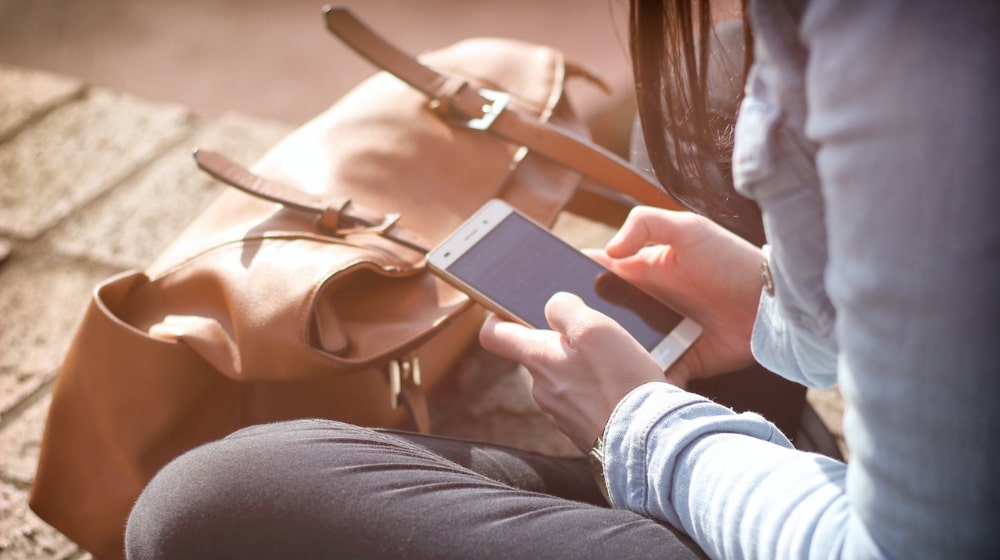 Woman looking at her smartphone