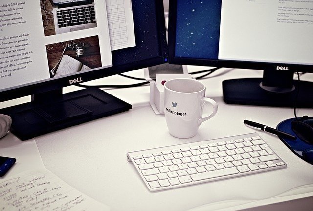 White desk with two monitors