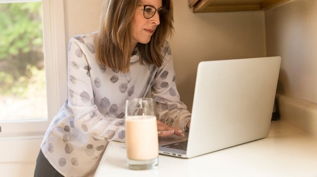 Working from Home Woman Working in Kitchen