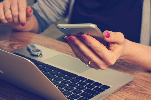 Budget App Woman with Laptop and Phone