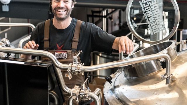 Corporation Tax Smiling Man on Brewery Floor