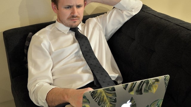 Employee Benefits Man Working on Laptop