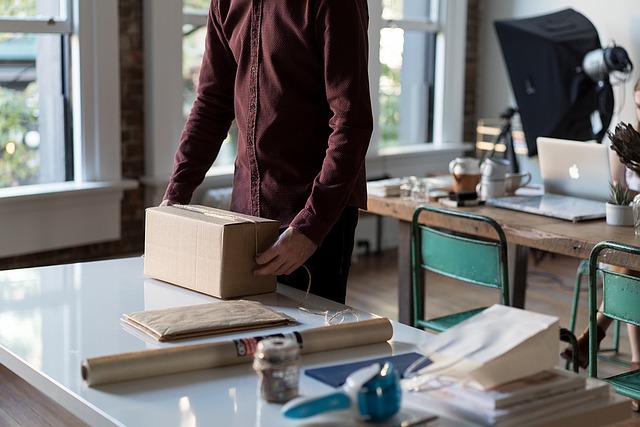 Survival Guide Person Preparing Box for Mailing