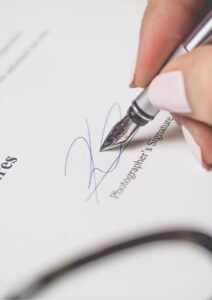 Mergers and Acquisitions Person Signing Document