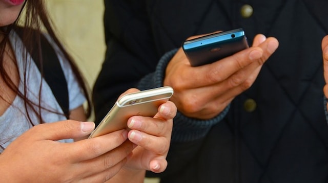 Online Advertising Two People on Smartphones