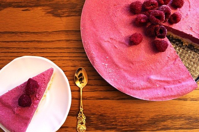 Pink cheesecake with raspberries on top